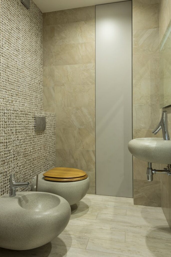 pexels-photo-7587376 A contemporary bathroom featuring stone textures and modern fixtures.